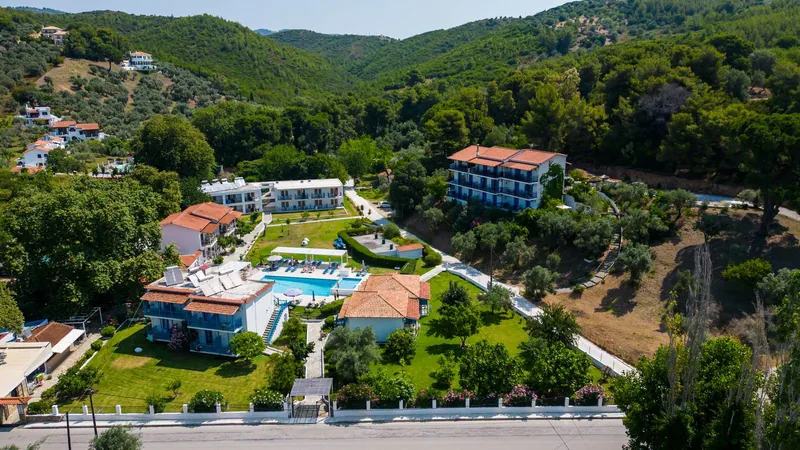 The hotel from above, with the green hills of Troulos behind