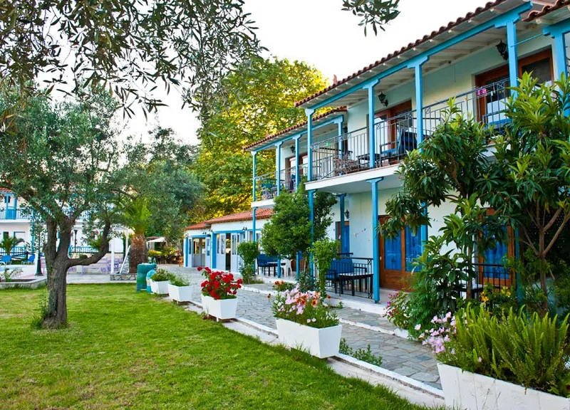 Blue balconies above the garden and its flower beds