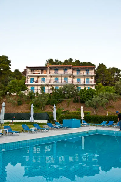 A hotel building seen across the pool