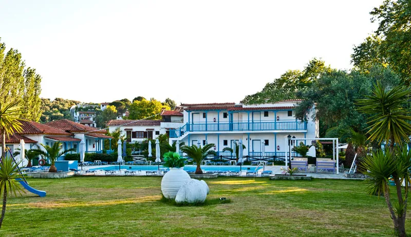 The lawn, the pool and the hotel buildings