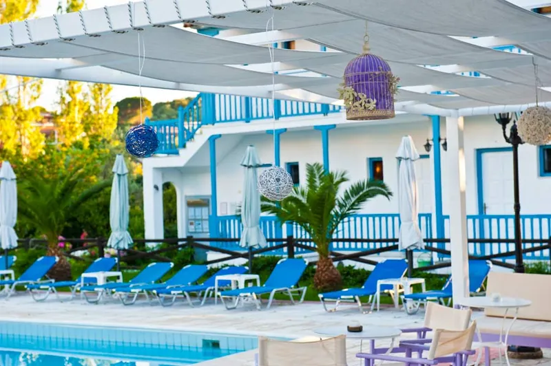 The pool bar, with blue sunbeds along the pool