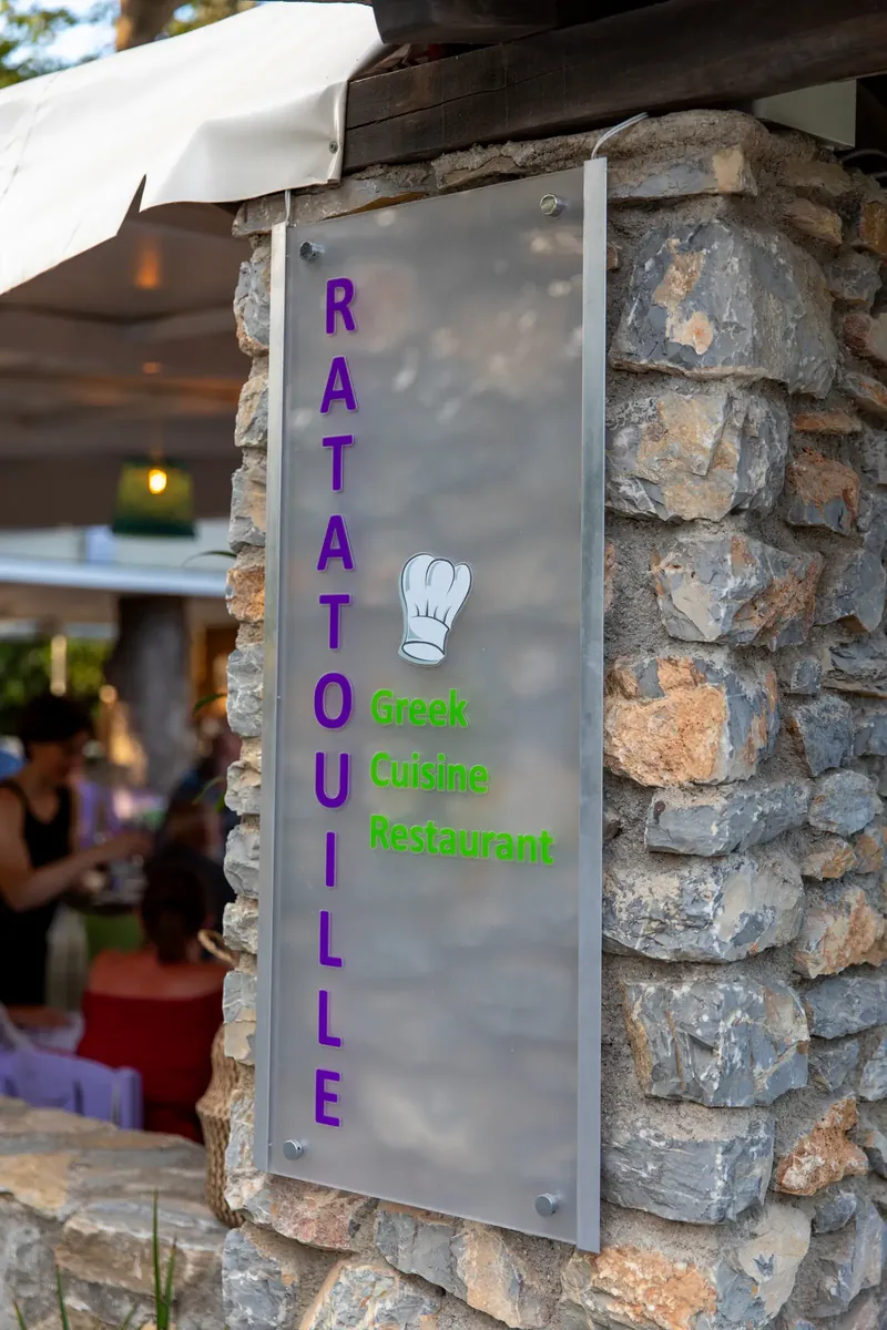 The Ratatouille sign on a stone pillar