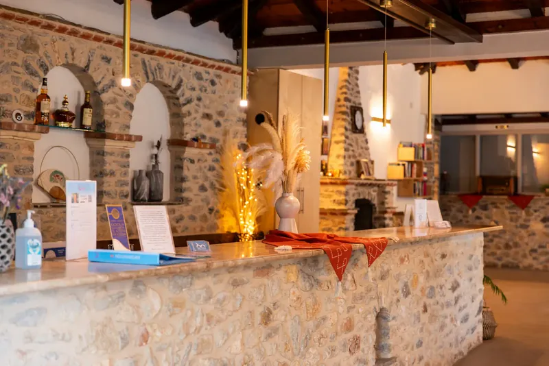 The stone reception desk with its arched niches